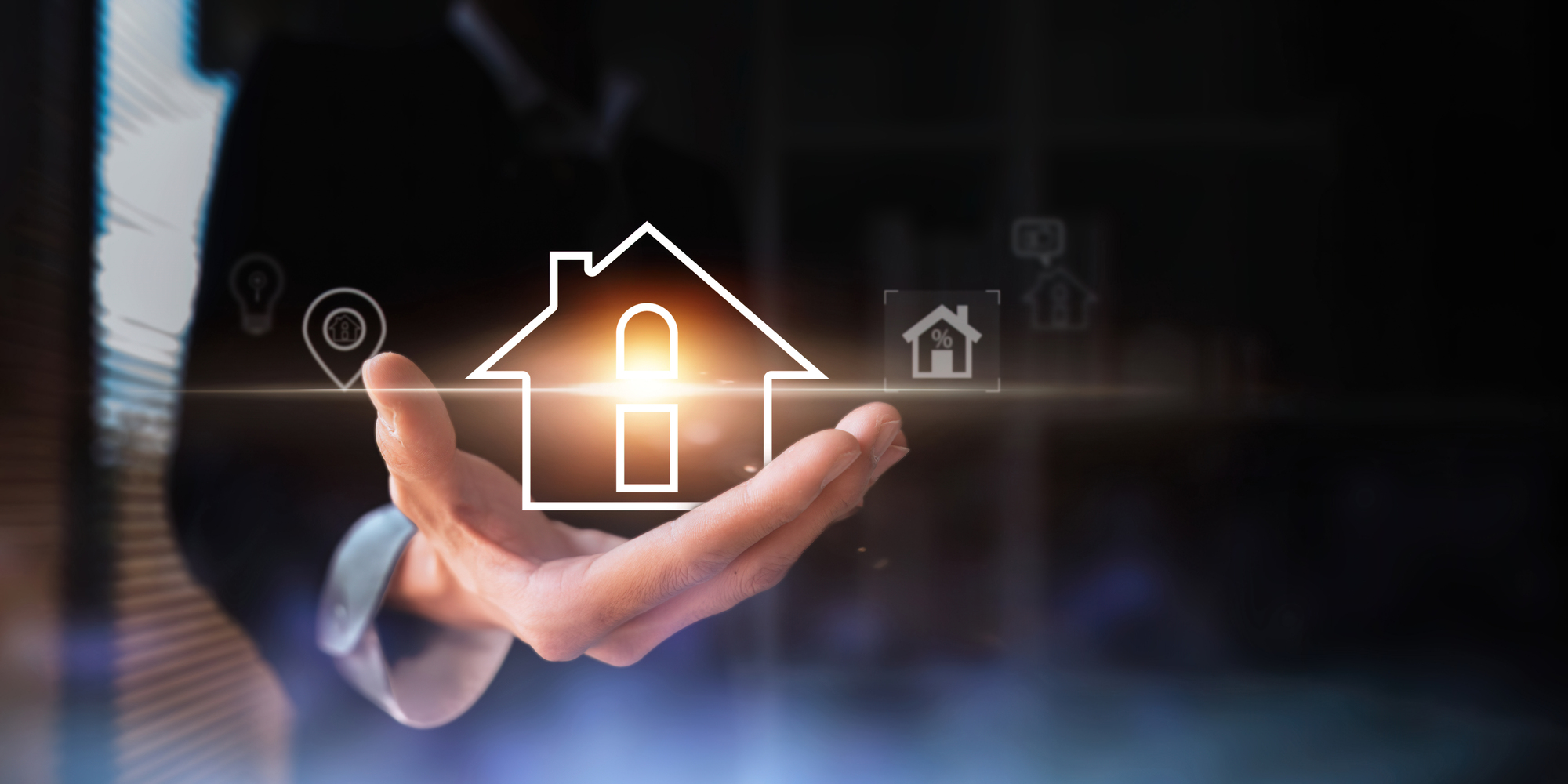BSymbolische Darstellung von Immobilienbesitz in einer Hand