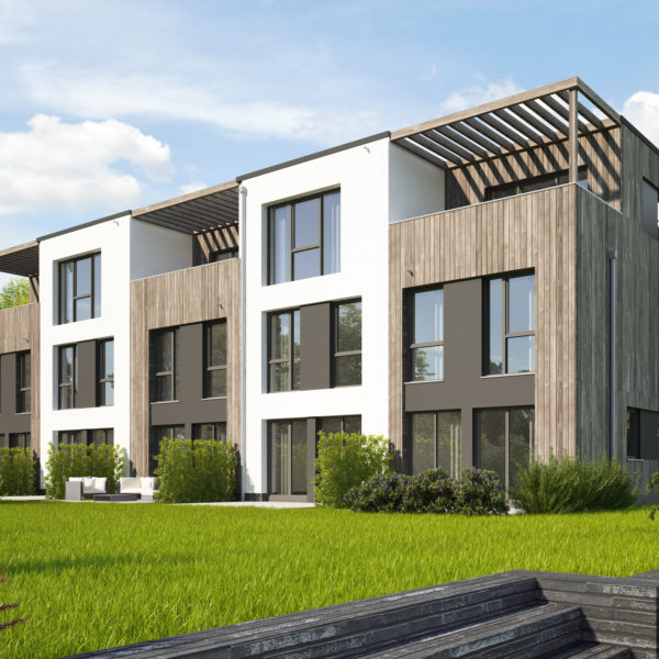 Modernes QNG Mehrfamilienhaus mit Grünflächen und Stellplätzen