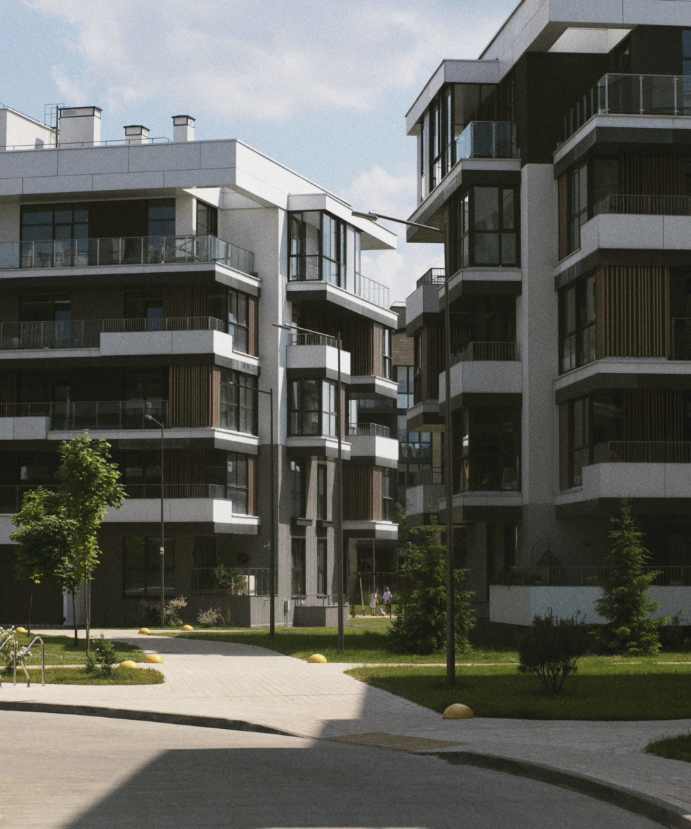 Neubau-Wohngebäude mit Glasbalkonen in sonniger Lage